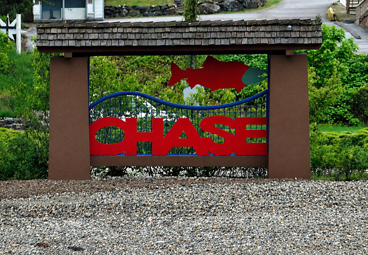 Chase sign surrounded by green hills and mountain scenery