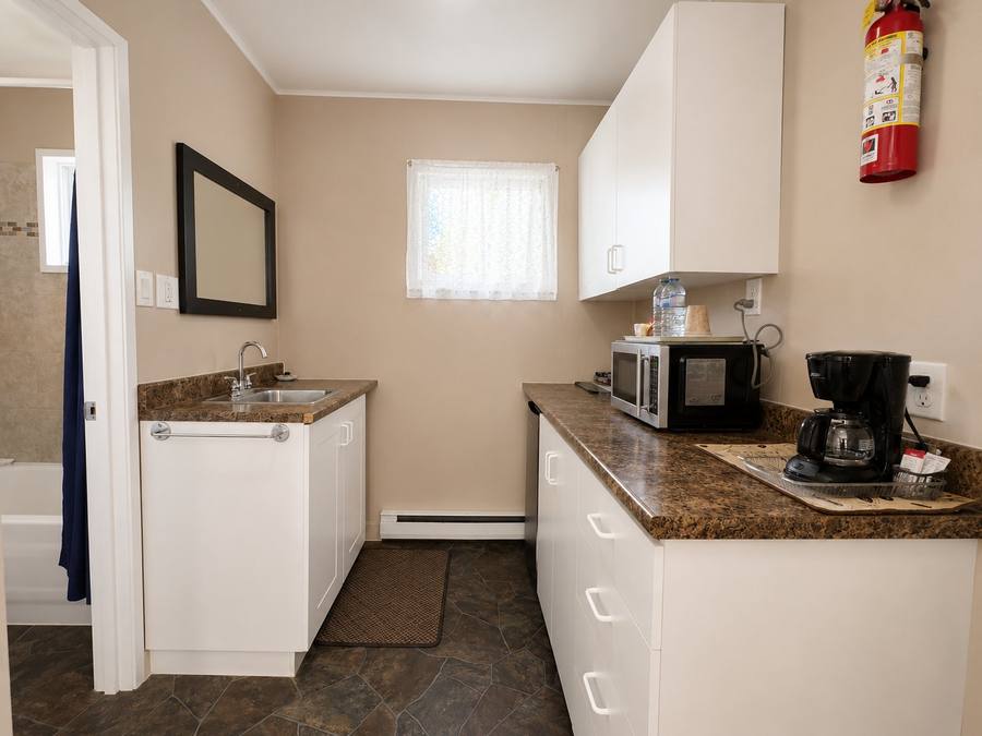Kitchenette with coffee maker and prep space